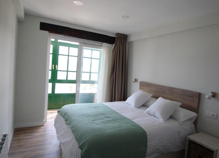 Apartamentos El Muelle โกมิญาส ภายนอก รูปภาพ