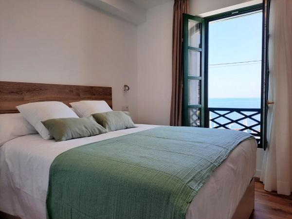 Apartamentos El Muelle โกมิญาส ภายนอก รูปภาพ