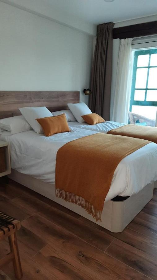 Apartamentos El Muelle โกมิญาส ภายนอก รูปภาพ